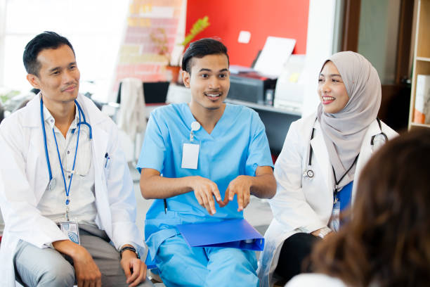 Malaysian medical student being taught in medical place.